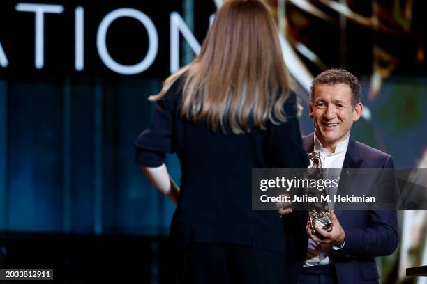 Justine Triet naccepts the 'Best Director' Cesar Award for the movie 'Anatomie d’une chute' from Dany Boon during the 49th Cesar Film Awards at...