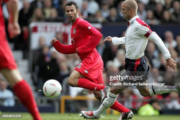 David Beckham of England and Ryan Giggs of Wales in action during the Group Six World Cup Qualifier, match between England and Wales at Old Trafford...