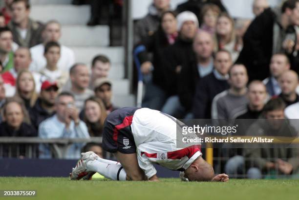 David Beckham of England is injured during the Group Six World Cup Qualifier, match between England and Wales at Old Trafford on October 9, 2004 in...