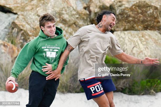 South Sydney Rabbitohs' Jye Gray, left, and John Sutton play American football on Coronado City Beach during a training session on February 26, 2024...