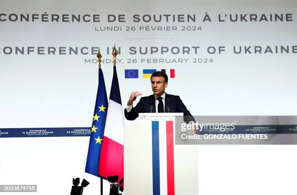 French President Emmanuel Macron speaks during a press conference at the end of the international conference aimed at strengthening Western support...