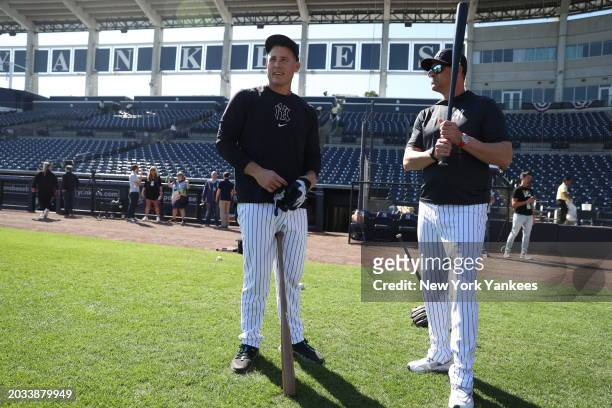 Manager, Aaron Boone of the New York Yankees and Anthony Rizzo talk before a spring training game against the Minnesota Twins at George M....