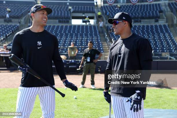 Giancarlo Stanton and Juan Soto of the New York Yankees talk before a spring training game against the Minnesota Twins at George M. Steinbrenner...
