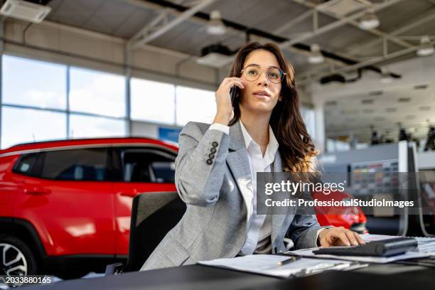 detail-oriented in the showroom - car dealership office stock pictures, royalty-free photos & images