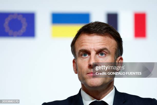 French President Emmanuel Macron looks on during a press conference at the end of the international conference aimed at strengthening Western support...