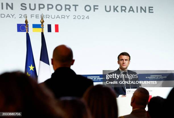 French President Emmanuel Macron looks on as he speaks during a press conference at the end of the international conference aimed at strengthening...