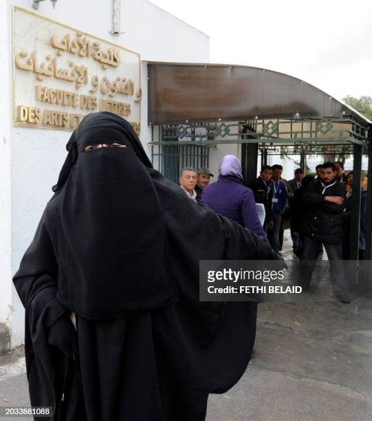 Tunisian student Noura, a history freshmen at University of Manouba's arts faculty, outside Tunis, leaves on January 24, 2012 the faculty after...