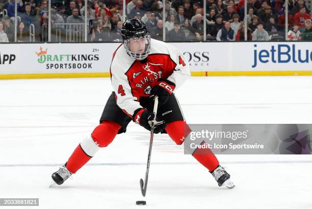 Northeastern defenseman Pito Walton holds the puck during the Beanpot Championship game between Boston University and Northeastern on February 12 at...