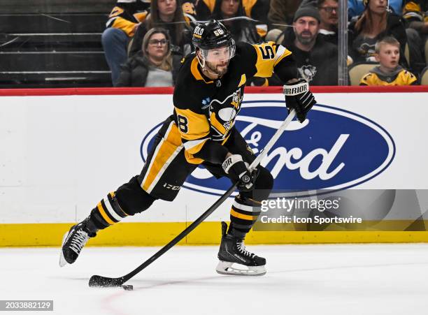 Pittsburgh Penguins defenseman Kris Letang shoots the puck during the third period in the NHL game between the Pittsburgh Penguins and the New York...