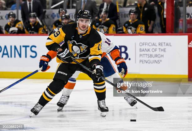 Pittsburgh Penguins right wing Reilly Smith skates with the puck during the third period in the NHL game between the Pittsburgh Penguins and the New...