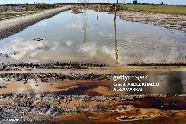 Picture shows an oil spill into an agricultural land in the region of Hamrin, north of Tikrit, in Iraq's province of Salaheddin, on February 19,...