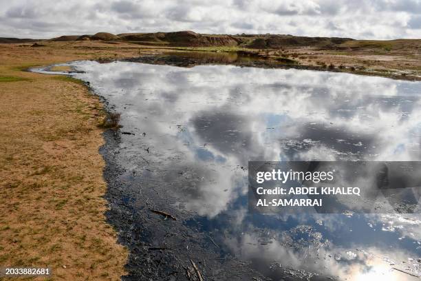 Picture shows an oil spill into an agricultural land in the region of Hamrin, north of Tikrit, in Iraq's province of Salaheddin, on February 19,...