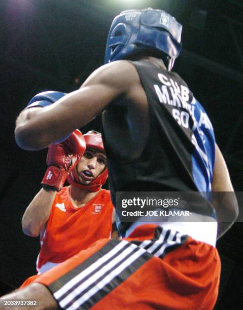 Amir Khan of Great Britain measures Mario Cesar Kindelan Mesa of Cuba during their lightweight boxing match at the Peristeri Boxing Hall 29 August...