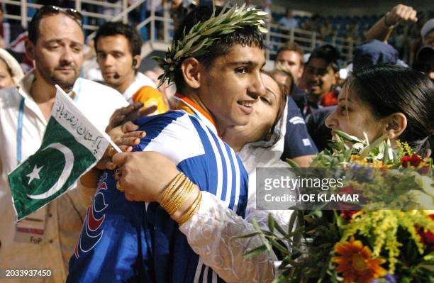 Silver medalist Amir Khan of Great Britain is greeted during the Olympic Games awards ceremony for the lighweight boxing competition 29 August 2004...