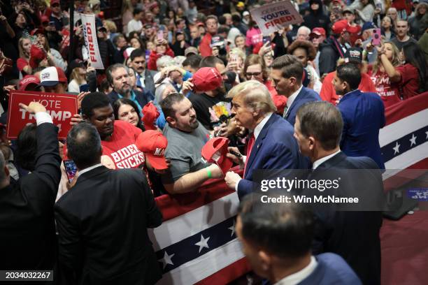 Republican presidential candidate and former President Donald Trump greets supporters after speaking at a Get Out The Vote rally at Winthrop...