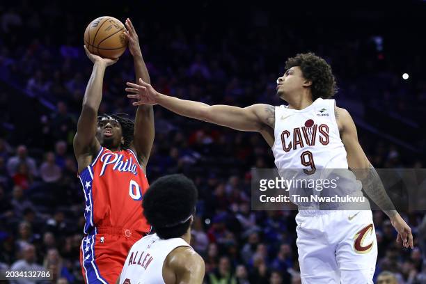 Tyrese Maxey of the Philadelphia 76ers shoots over Jarrett Allen and Craig Porter of the Cleveland Cavaliers during the first quarter at the Wells...