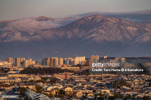 snowcapped mountain and the residential district in kanagawa of japan - kanto region ストックフォトと画像