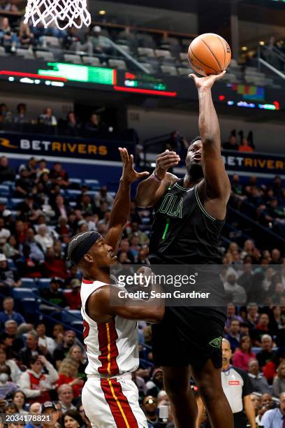 Zion Williamson of the New Orleans Pelicans shoots over Jimmy Butler of the Miami Heat during the second quarter of an NBA game at Smoothie King...