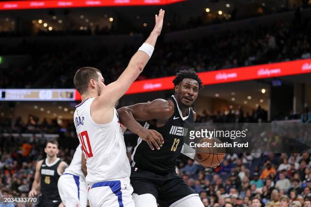 Jaren Jackson Jr. #13 of the Memphis Grizzlies goes to the basket against Ivica Zubac of the LA Clippers during the second half at FedExForum on...