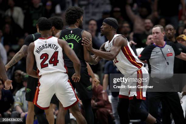 Naji Marshall of the New Orleans Pelicans and Jimmy Butler of the Miami Heat are involved in an altercation during the fourth quarter of an NBA game...