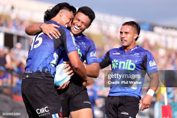 Zarn Sullivan of the Blues celebrates his try with Caleb Clarke during the round one Super Rugby Pacific match between the Blues and Fijian Drua at...