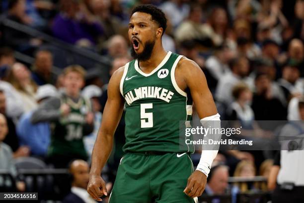 Malik Beasley of the Milwaukee Bucks celebrates his three-point basket against the Minnesota Timberwolves in the third quarter at Target Center on...