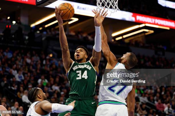 Giannis Antetokounmpo of the Milwaukee Bucks goes up for a shot against Rudy Gobert of the Minnesota Timberwolves in the fourth quarter at Target...