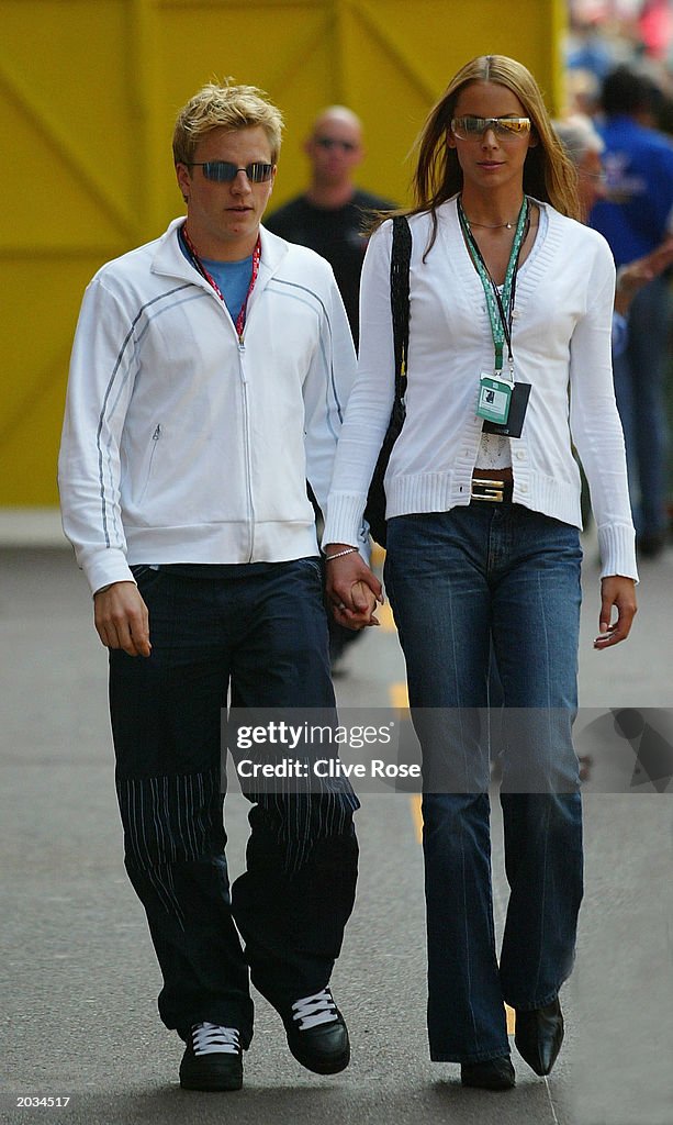 Kimi Raikkonen arrives with his girlfriend Jeny