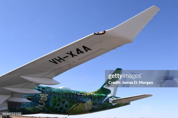 An Airbus A220 for QantasLink on the tarmca after it landed at Ayers Rock Airport on February 22, 2024 in Uluru, Australia. QantasLink today unveiled...