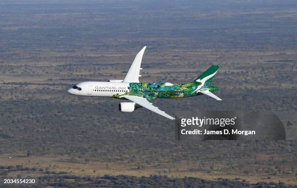 An aerial image of an Airbus A220 for QantasLink on February 22, 2024 in Uluru, Australia. QantasLink today unveiled their new cabins inside the...