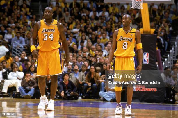 Shaquille O'Neal and Kobe Bryant of the Los Angeles Lakers stand on the court in Game Three of the Western Conference Semifinals against the San...
