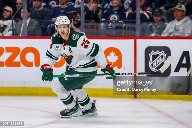 Jonas Brodin of the Minnesota Wild keeps an eye on the play during first period action against the Winnipeg Jets at the Canada Life Centre on...