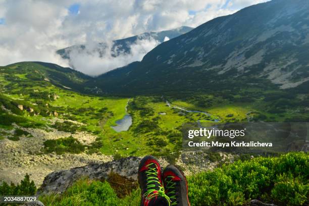 feet of resting hiker on top of mountain - green high heels stock pictures, royalty-free photos & images