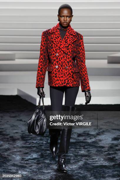 Model walks the runway during the Versace Ready to Wear Fall/Winter 2024-2025 fashion show as part of the Milan Fashion Week on February 23, 2024 in...