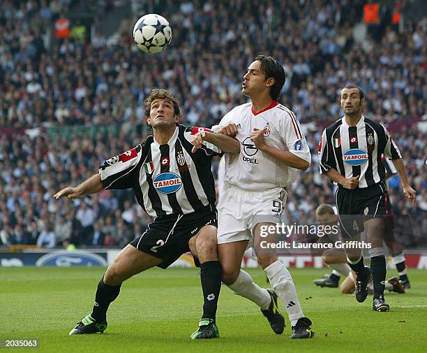 Filippo Inzaghi of AC Milan battles for possession Ciro Ferrara of Juventus FC during the UEFA Champions League Final match between Juventus FC and...