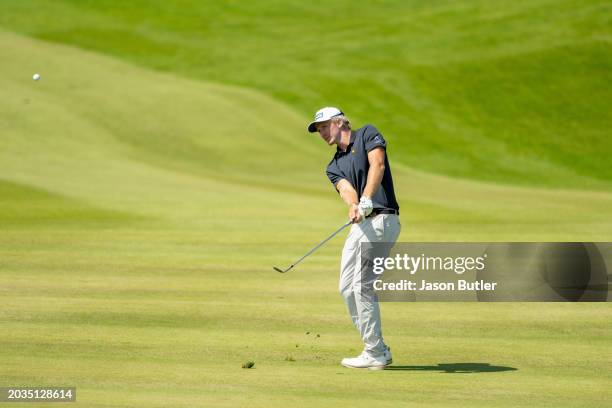 Travis Smyth of Australia pitches onto the green on hole 7 during the third round of the International Series Oman at Al Mouj Golf on February 24,...