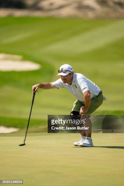 Louis Oosthuizen of South Africa lines up his putt on hole 7 during the third round of the International Series Oman at Al Mouj Golf on February 24,...
