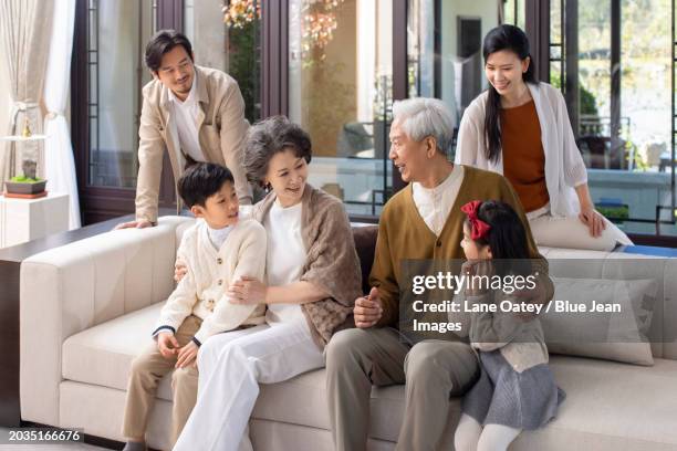 spending time with family on chinese new year - big hug stock pictures, royalty-free photos & images