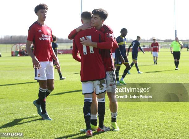 Ashton Missin of Manchester United celebrates with team mate Harry Amass after scoring his sides second goal during the U18 Premier League match...