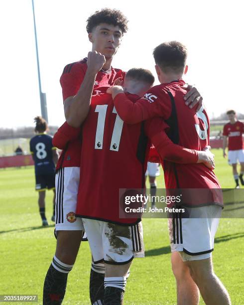 Ashton Missin of Manchester United celebrates with team mates Harry Amass and Ethan Wheatley after scoring his sides second goal during the U18...