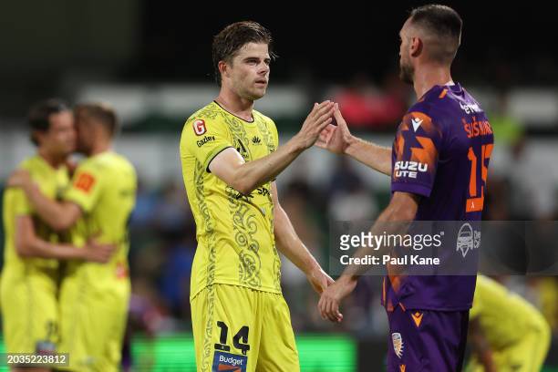 Alex Rufer of the Phoenix and Aleksandar Susnjar of the Glory shake hands following the A-League Men round 18 match between Perth Glory and...