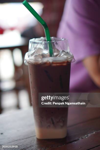 dinking chocolate mint ice in plastic cup - tubules stock pictures, royalty-free photos & images