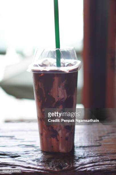 chocolate milk ice in plastic cup - tubules stock pictures, royalty-free photos & images