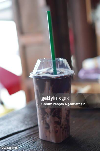 chocolate milk ice in plastic cup - tubules stock pictures, royalty-free photos & images