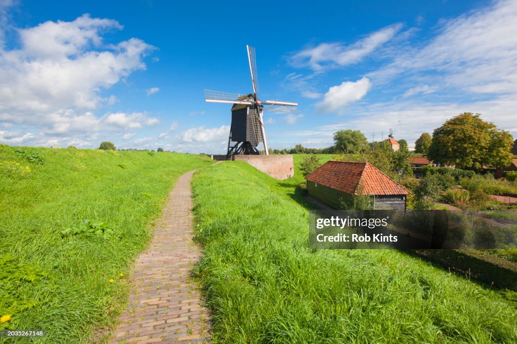 Windmill on the dike (levee) of fortified city of Heusden