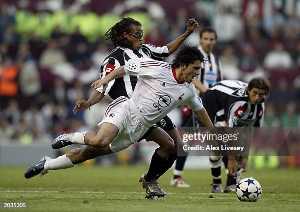 Gennaro Gattuso of Milan is tackled by Edgar Davids of Juventus during the UEFA Champions League Final match between Juventus FC and AC Milan on May...