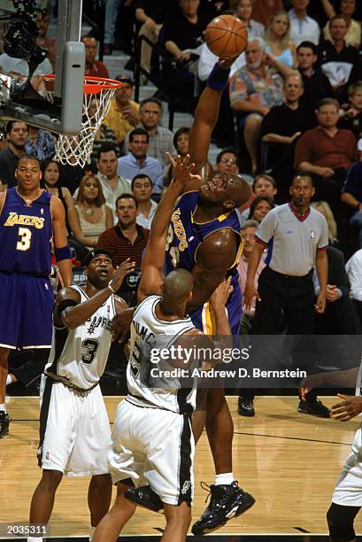 Shaquille O'Neal of the Los Angeles Lakers goes up with the ball against Tim Duncan of the San Antonio Spurs in Game One of the Western Conference...