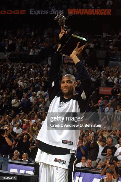 Tim Duncan of the San Antonio Spurs raises the MVP trophy prior to Game One of the Western Conference Semifinals against the Los Angeles Lakers...