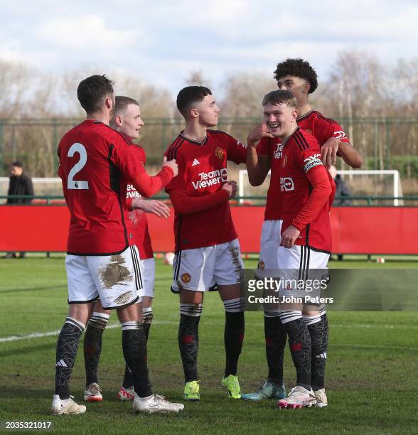 Ethan Wheatley of Manchester United celebrates with team mates after scoring his teams third goal during the U18 Premier League match between...