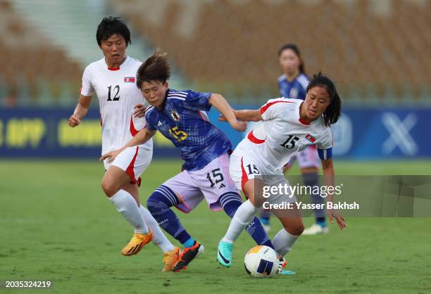 Aoba Fujino of Japan is challenged by Wi Jong-Sim of North Korea during the AFC Women's Olympic Football Tournament Paris 2024 Asian Final Qualifier...